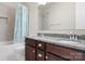 Modern bathroom with a double sink vanity and a shower tub at 137 Brawley Woods Ln, Mooresville, NC 28115