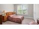 Bedroom with a charming comforter set and a large window that provides plenty of light at 137 Brawley Woods Ln, Mooresville, NC 28115