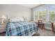 Comfortable bedroom with a large window that provides plenty of light at 137 Brawley Woods Ln, Mooresville, NC 28115