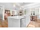 Open-concept kitchen with a spacious island, modern appliances, and views of the living and dining areas at 137 Brawley Woods Ln, Mooresville, NC 28115