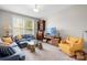 Comfortable living room featuring plenty of seating and a large window at 137 Brawley Woods Ln, Mooresville, NC 28115