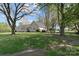 A large backyard with well-maintained lawn surrounds a charming home with ample trees and space for outdoor activities at 14855 Nc 801 Hwy Hwy, Mt Ulla, NC 28125