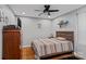 Cozy bedroom with hardwood floors, ceiling fan, and neutral color scheme at 14855 Nc 801 Hwy Hwy, Mt Ulla, NC 28125
