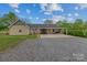 Charming single story home featuring a welcoming front porch with stone details at 14855 Nc 801 Hwy Hwy, Mt Ulla, NC 28125