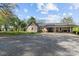 Charming single-story home with a covered porch, gravel driveway, and well-maintained landscaping at 14855 Nc 801 Hwy Hwy, Mt Ulla, NC 28125