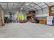 Spacious garage offers ample storage with metal walls, high ceilings, and lots of room for parking and hobbies at 14855 Nc 801 Hwy Hwy, Mt Ulla, NC 28125