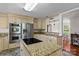 Open-concept kitchen with granite island, stainless steel appliances, and ample cabinet space at 14855 Nc 801 Hwy Hwy, Mt Ulla, NC 28125