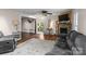 Inviting living room area with hardwood floors, stone fireplace, and warm, neutral colors at 14855 Nc 801 Hwy Hwy, Mt Ulla, NC 28125