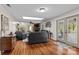 Spacious living room with hardwood floors, skylights, fireplace, and lots of natural light at 14855 Nc 801 Hwy Hwy, Mt Ulla, NC 28125