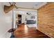 Inviting living room with hardwood floors, stone fireplace, and a deer head over the entrance at 14855 Nc 801 Hwy Hwy, Mt Ulla, NC 28125