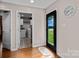 Mudroom featuring exterior door, clock, and doorway leading to laundry room at 14855 Nc 801 Hwy Hwy, Mt Ulla, NC 28125