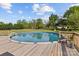 This above ground pool with surrounding wooden deck, creates a private and inviting outdoor space for leisure at 14855 Nc 801 Hwy Hwy, Mt Ulla, NC 28125