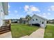 Well-maintained backyard with lush lawn, steps to the patio, and a fenced area for privacy at 1501 Riverwalk Pkwy, Rock Hill, SC 29730
