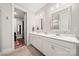 A bathroom featuring a double vanity, modern lighting, and a view of the shower at 1501 Riverwalk Pkwy, Rock Hill, SC 29730
