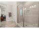 A bathroom shower with a glass door, tiled walls, and modern fixtures at 1501 Riverwalk Pkwy, Rock Hill, SC 29730