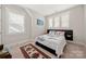 Bedroom with lots of natural light and a unique bed frame and headboard at 1501 Riverwalk Pkwy, Rock Hill, SC 29730