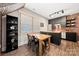 Dining area featuring a wood table, black chairs, and exposed brick at 1501 Riverwalk Pkwy, Rock Hill, SC 29730
