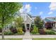 Charming two-story home with stone and siding facade and lush landscaping in the front yard at 1501 Riverwalk Pkwy, Rock Hill, SC 29730