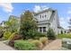 Well-manicured front lawn and garden showcasing the side of this stunning two-story home at 1501 Riverwalk Pkwy, Rock Hill, SC 29730