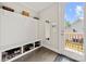 A mudroom with a built-in bench, shoe storage, and a door to the outside at 1501 Riverwalk Pkwy, Rock Hill, SC 29730