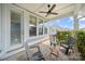 Inviting covered patio with comfortable seating and a ceiling fan, perfect for outdoor relaxation at 1501 Riverwalk Pkwy, Rock Hill, SC 29730