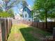 Fenced backyard with green grass ready for outdoor entertaining and activities at 1511 Landis Ave, Charlotte, NC 28205