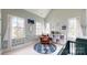 Bright Bedroom featuring windows, a glider chair, colorful decor, and a tall ceiling at 1511 Landis Ave, Charlotte, NC 28205