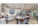Bright kitchen featuring a central island with seating and stainless steel appliances at 1511 Landis Ave, Charlotte, NC 28205