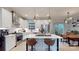 Well-appointed kitchen with stainless steel appliances, island with bar seating and modern lighting at 1511 Landis Ave, Charlotte, NC 28205