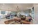 Open-concept living space with seamless flow from kitchen and dining to living room at 1511 Landis Ave, Charlotte, NC 28205