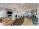 Open-concept living room with fireplace, seamlessly connected to the modern kitchen and dining area at 1511 Landis Ave, Charlotte, NC 28205
