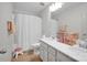 Bright bathroom with a double sink vanity and shower-tub combo at 15127 Oleander Dr, Charlotte, NC 28278