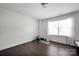 Bright bonus room with hardwood floors, a window, and a place for exercise equipment at 15127 Oleander Dr, Charlotte, NC 28278