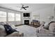 Bright living room featuring a fireplace, plush seating, and an inviting atmosphere at 15127 Oleander Dr, Charlotte, NC 28278