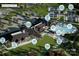 Aerial view of the community clubhouse, resort style pool, grilling areas, and recreation courts at 1619 Shoals Ave # 156, Belmont, NC 28012