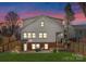 Large backyard featuring a patio, fenced yard, and outdoor seating area for relaxation and entertaining at 1751 Merriman Ave, Charlotte, NC 28203