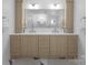 Bathroom featuring double vanities, ample storage, quartz counters and modern fixtures with an open design at 1751 Merriman Ave, Charlotte, NC 28203