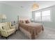 Serene bedroom featuring neutral tones, soft textures, and natural light from the windows at 1751 Merriman Ave, Charlotte, NC 28203
