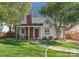 Charming home with manicured lawn, brick chimney, and covered front porch, perfect for relaxing at 1751 Merriman Ave, Charlotte, NC 28203