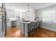 Modern kitchen island with stainless steel appliances, pendant lighting, and bar seating, stylish and functional at 1751 Merriman Ave, Charlotte, NC 28203