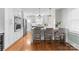 Modern kitchen featuring stainless steel appliances, breakfast bar, and ample storage, perfect for cooking at 1751 Merriman Ave, Charlotte, NC 28203