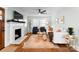 Cozy living room with fireplace, plush seating, and natural light, creating an inviting atmosphere at 1751 Merriman Ave, Charlotte, NC 28203