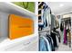 A luxurious walk-in closet with custom shelves, cabinets, and hanging rods providing ample storage at 1751 Merriman Ave, Charlotte, NC 28203