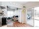 Bright living room featuring hardwood floors, a comfortable sofa, access to a deck, and ample natural light at 2012 Galty Ln, Charlotte, NC 28270