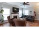 Inviting living room features a fireplace, hardwood floors, and large windows at 2012 Galty Ln, Charlotte, NC 28270