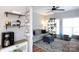 Cozy living room with a comfortable couch, indoor plants, and large windows allowing for plenty of sunlight at 2012 Galty Ln, Charlotte, NC 28270
