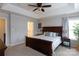 Spacious main bedroom features a tray ceiling, ceiling fan and ensuite bathroom at 2012 Galty Ln, Charlotte, NC 28270