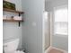 Bathroom shower features an enclosed shower with a sliding glass door and white tile surround at 2012 Galty Ln, Charlotte, NC 28270