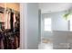 View into walk-in closet adjacent to bathroom at 2012 Galty Ln, Charlotte, NC 28270