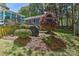 Outdoor space featuring a stone patio with a grill, surrounded by landscaping, perfect for entertaining guests at 218 Kimrod Ln, Charlotte, NC 28270